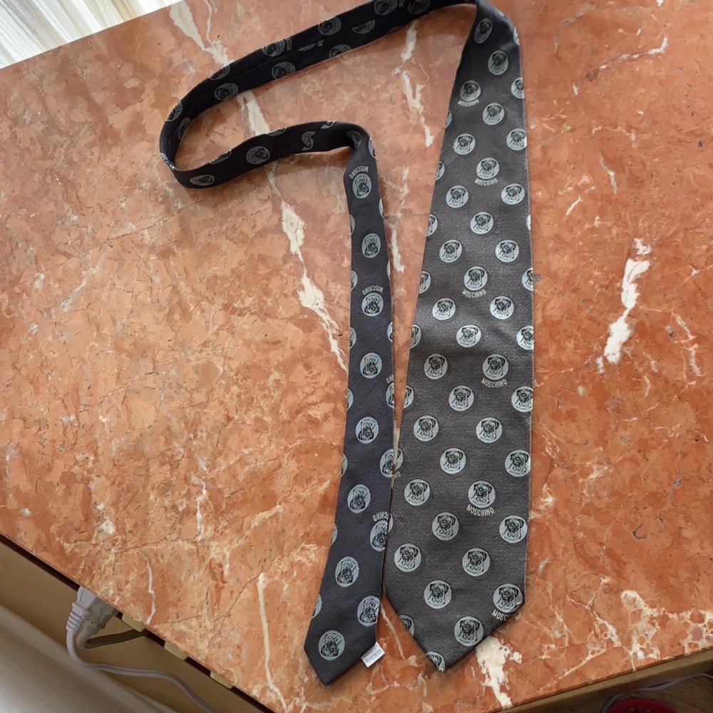Authentic Moschino tie all over logo goes with every suit & top good condition